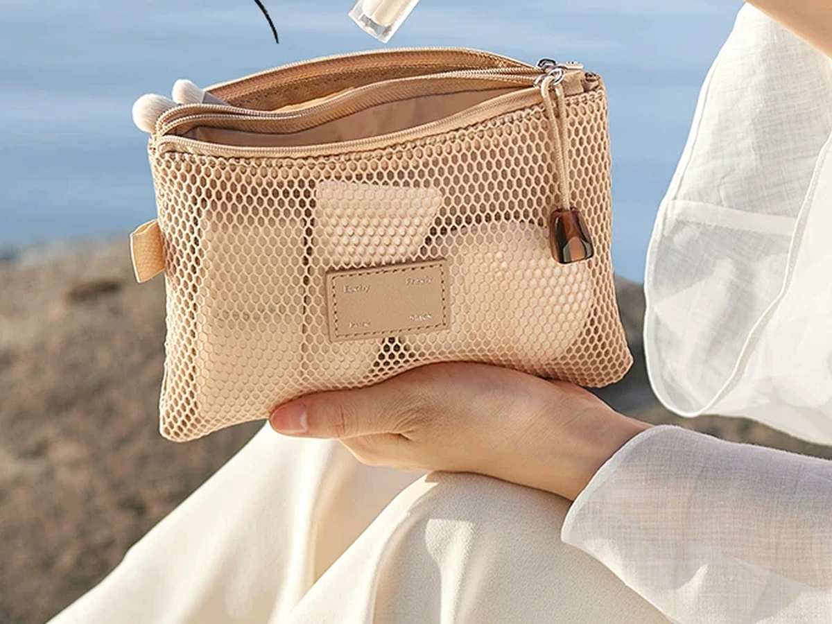 Mesh travel accessory pouch in an outdoor travel scene